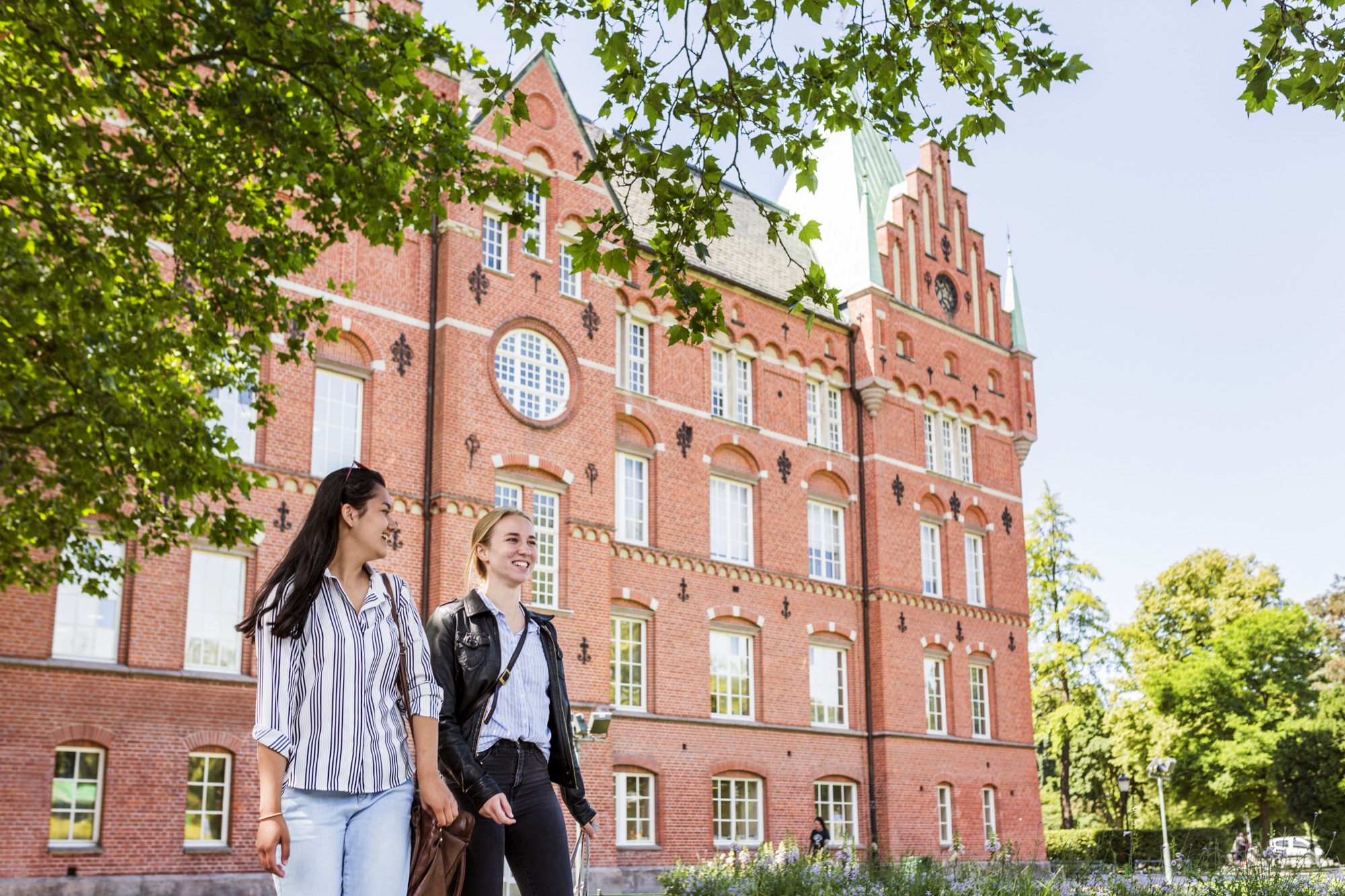 Students walking in front of a university building